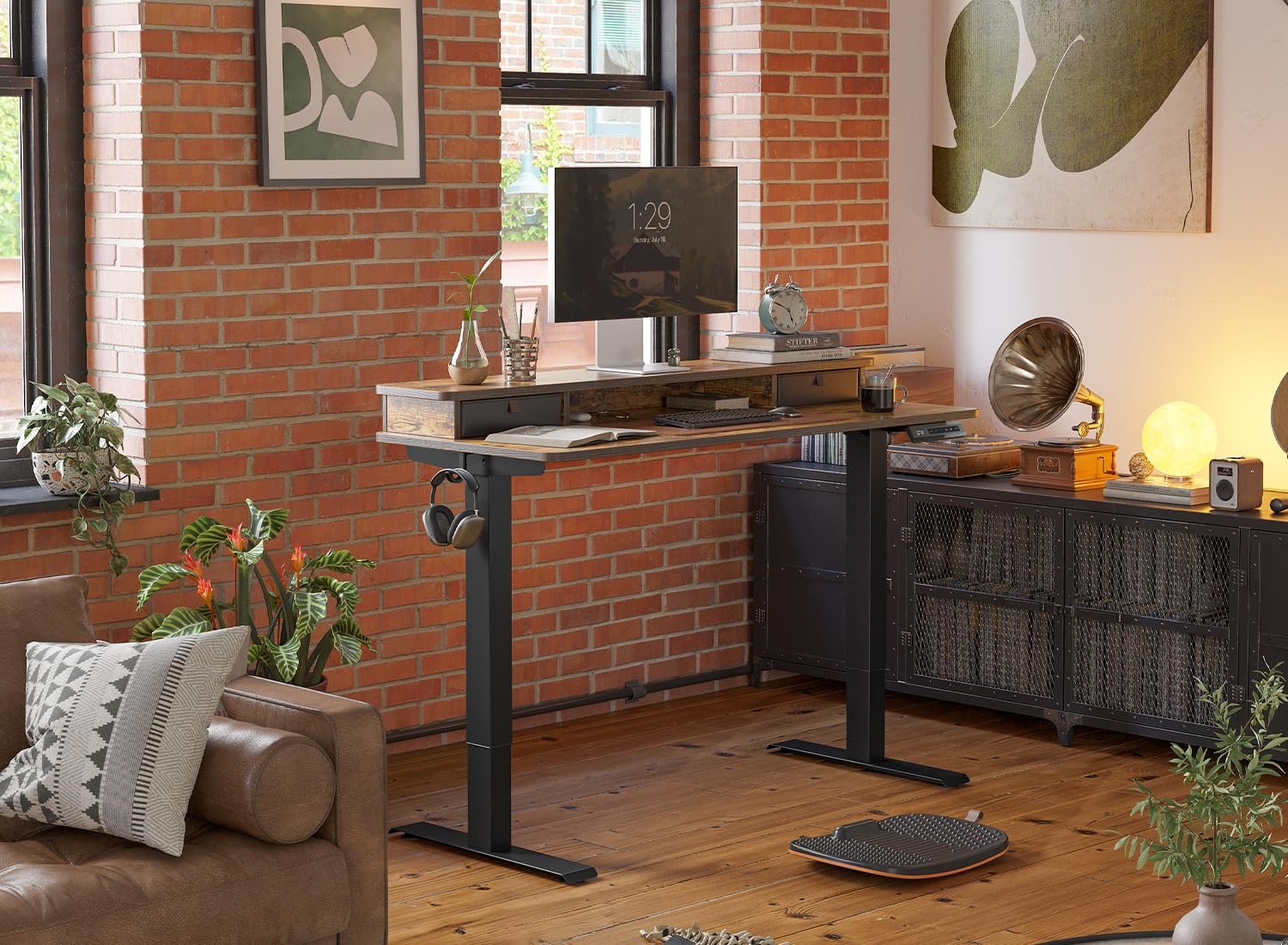 FEZIBO 40-inch standing desk raised to standing height with monitor setup